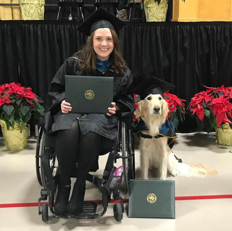 griffin posing with brittany and their diploma
