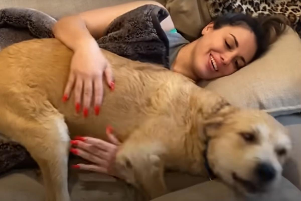 laura and murphy playing on the couch