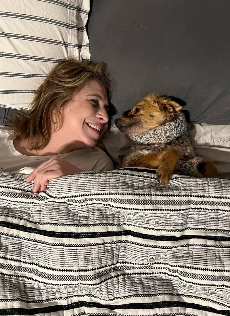 smile in the bed with her owner