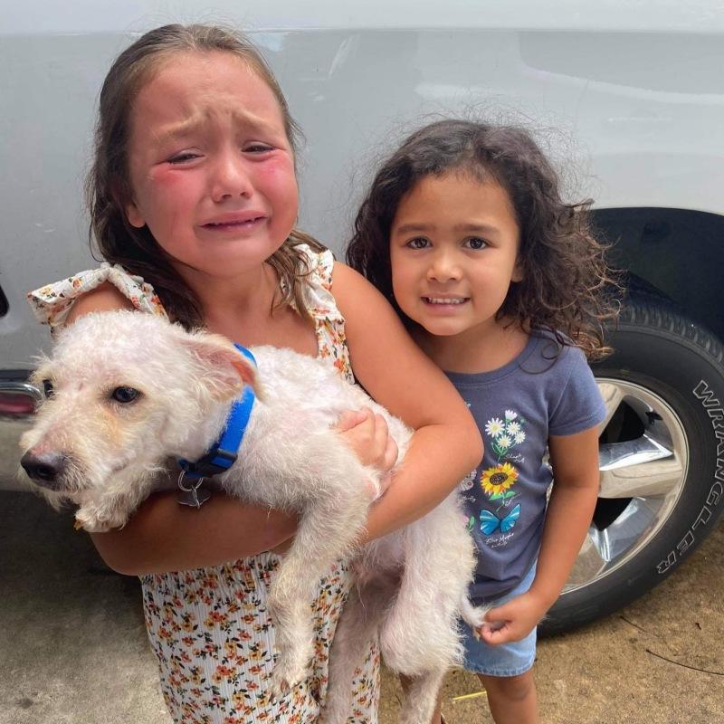 the two girls crying with max in their arms