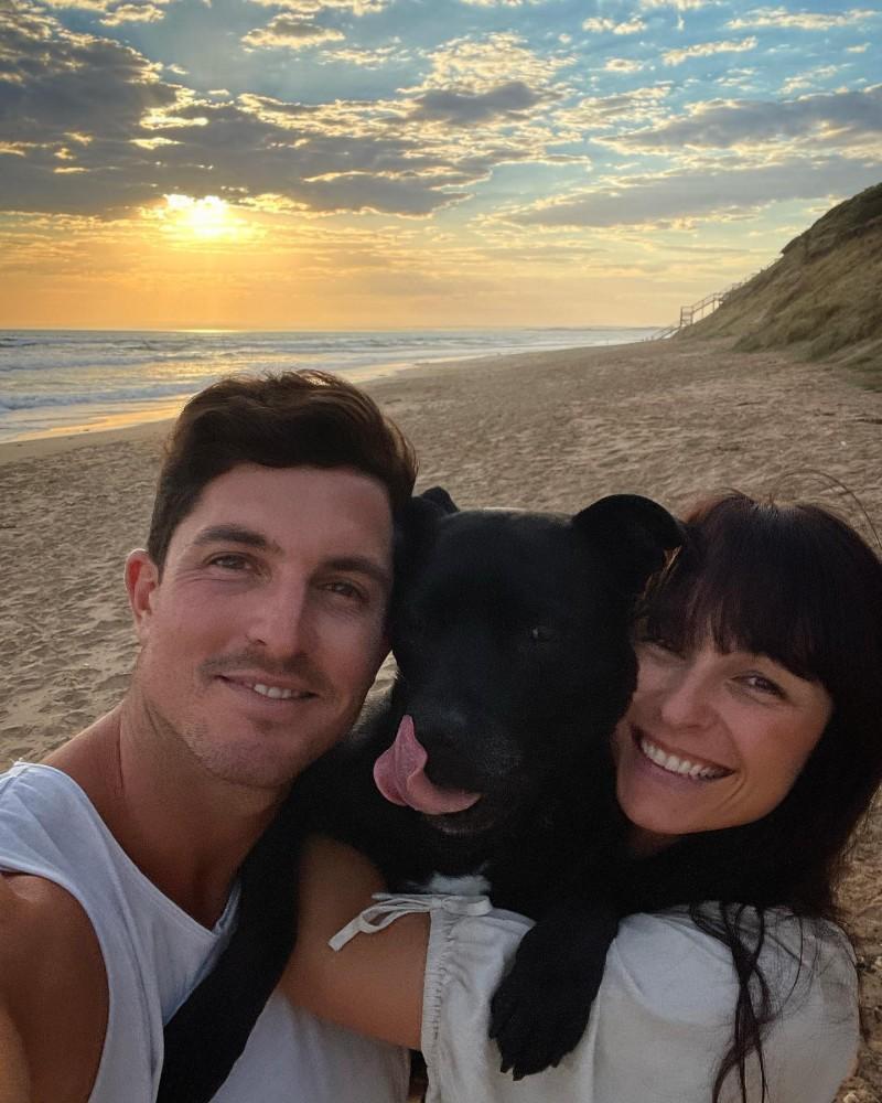 drew dennis and wife at the beach