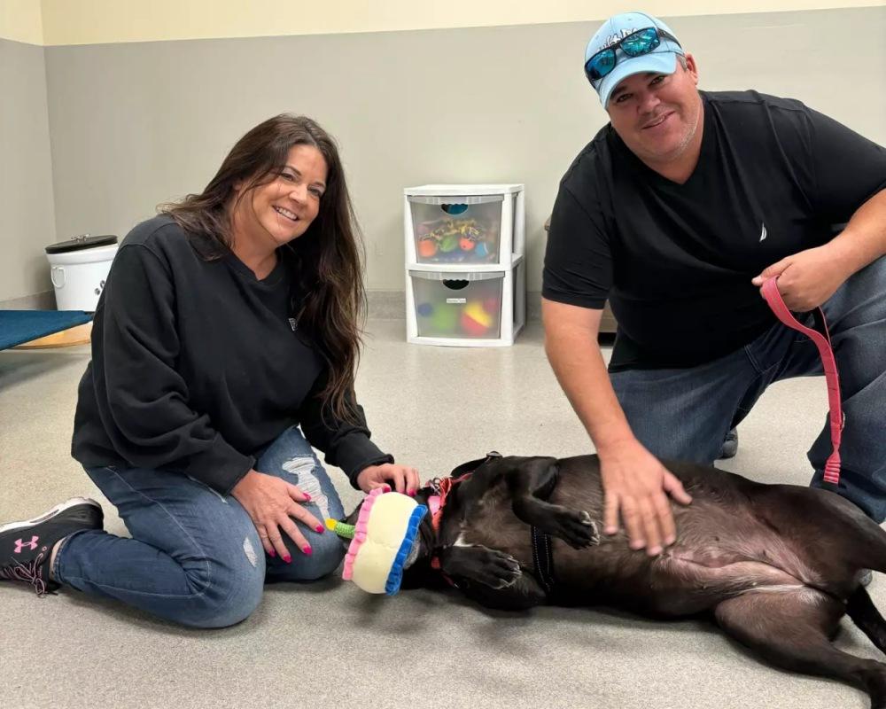 tessy with her new dad and mom