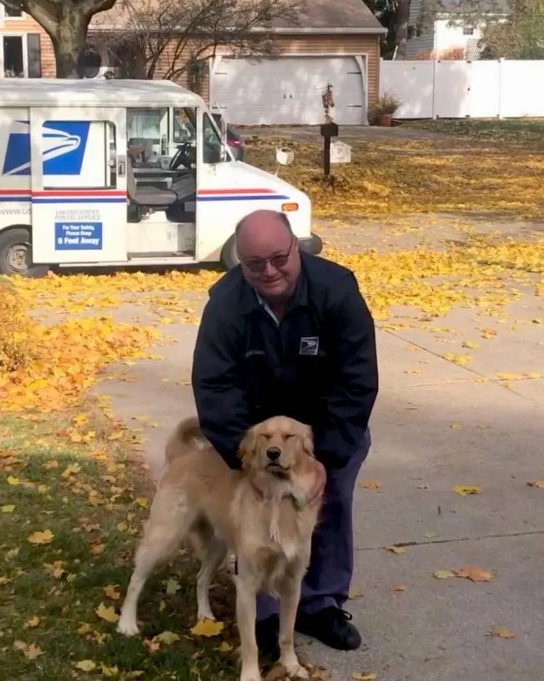 dog and mailman having fun