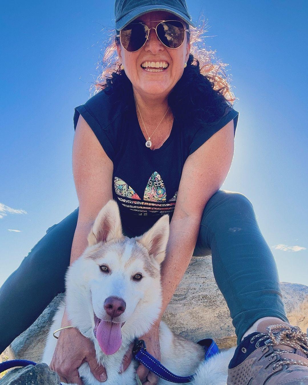 puppy and happy woman