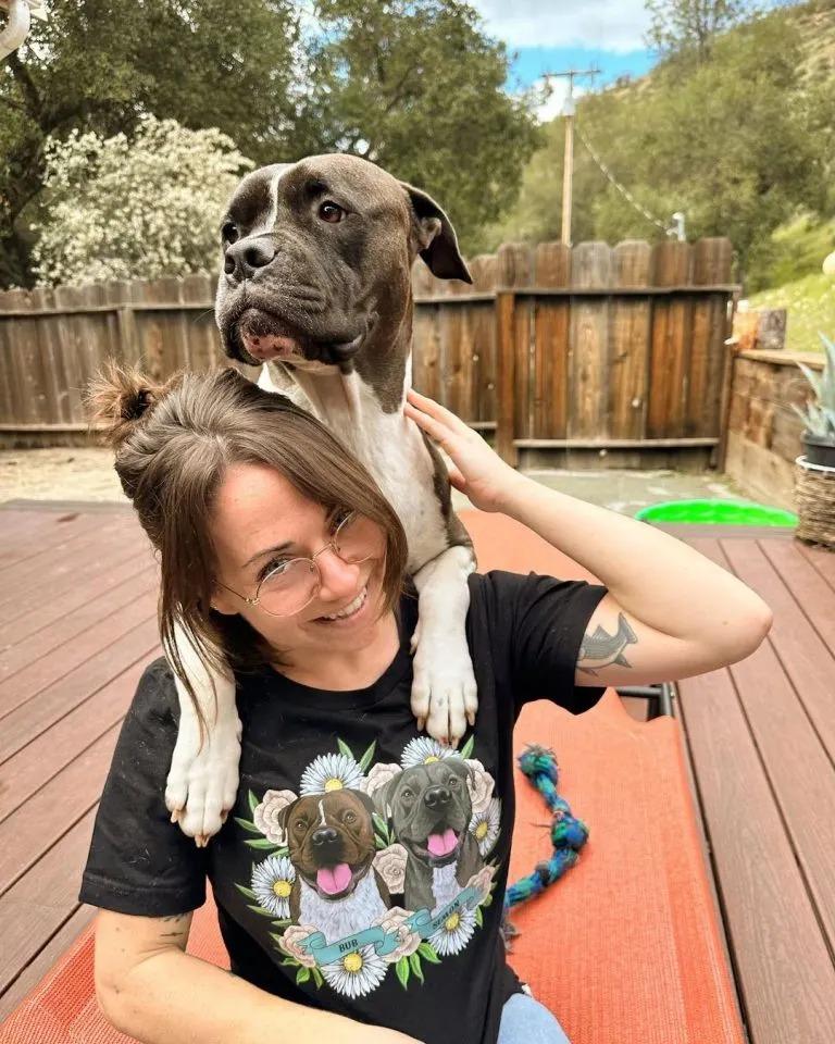 dog on womans shoulders