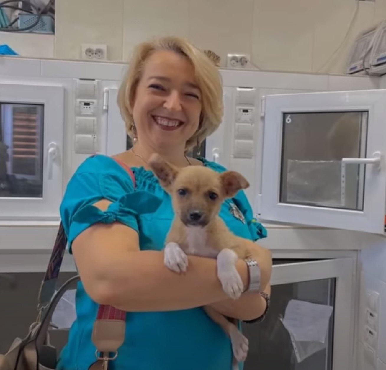 woman holding dog